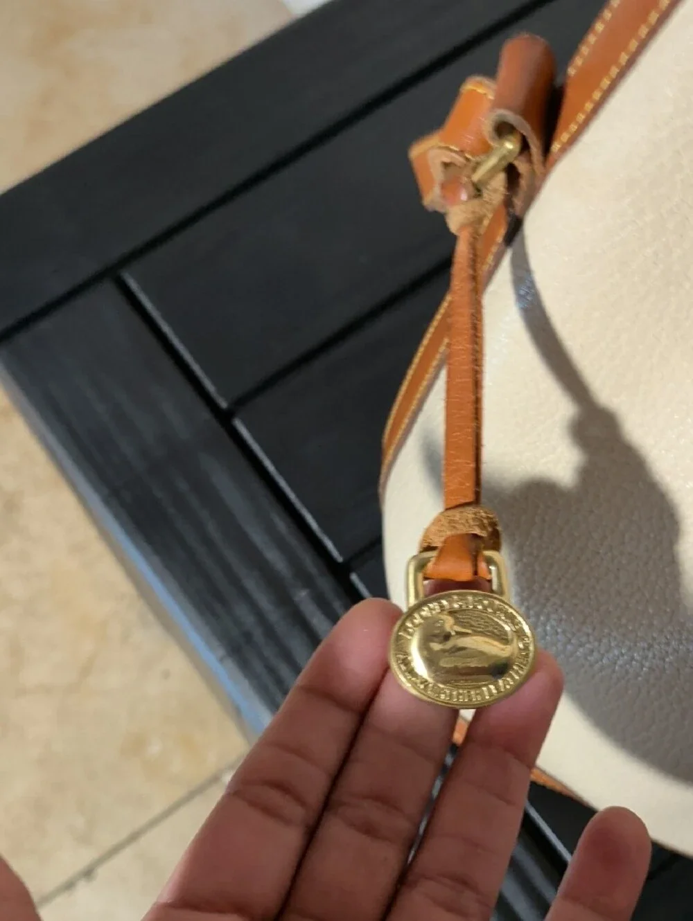 Dooney & Bourke Cream and Brown Drawstring Bucket Bag